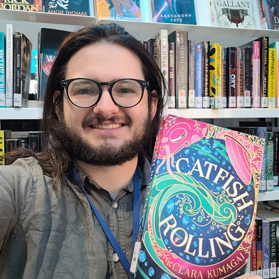 Librarian Stephen holds a copy of Catfish Rolling