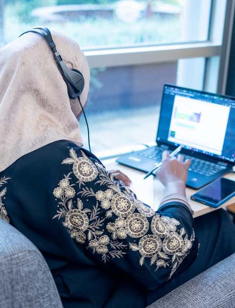 using a laptop at the library