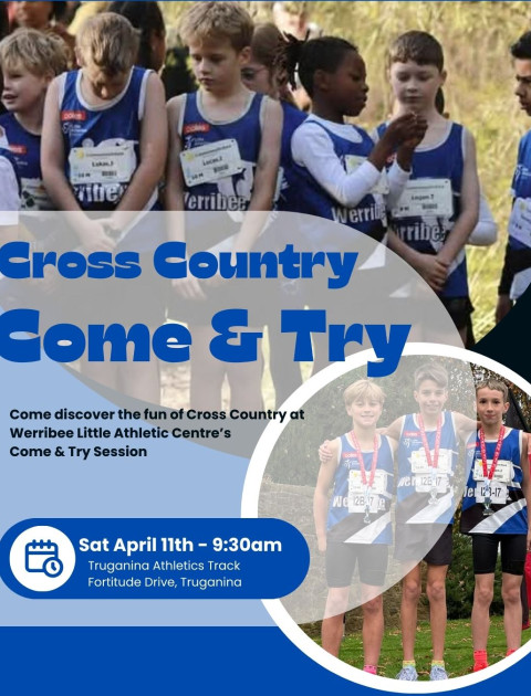 a group of kids in blue and white running vests stand on a start line