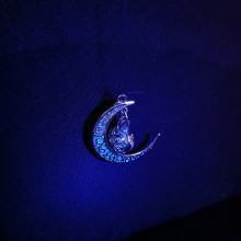 UV moonlight by Tazmeen. A UV glowing moon charm in the Dark. - Copy