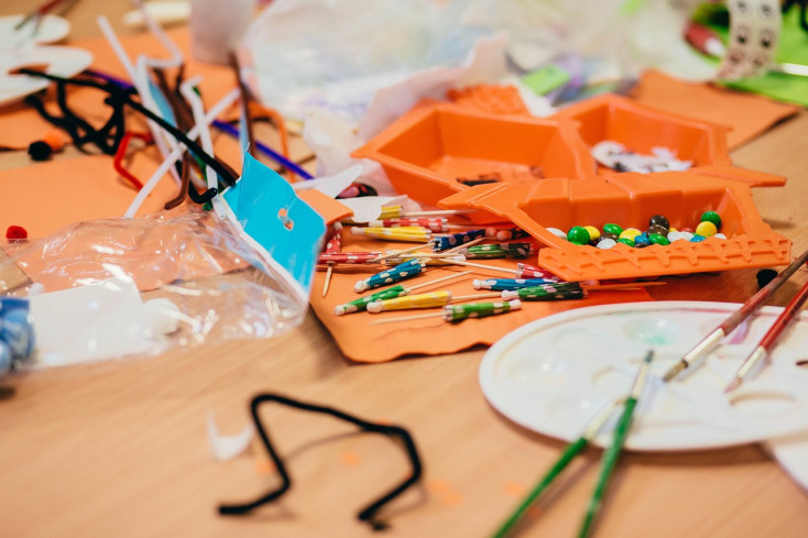 Colourful craft materials spread out on a table.