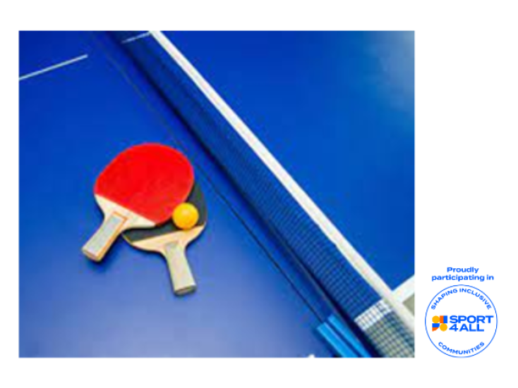 Blue table tennis table and net with a red and black bat resting and a yellow table tennis ball