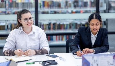 Two young people in the library