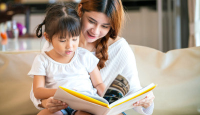 A mum and child read together