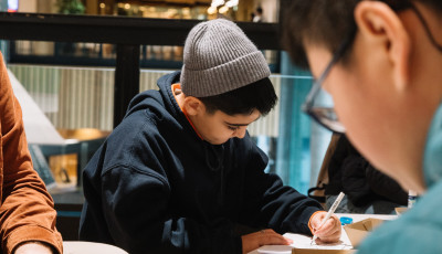 Child drawing at a table.