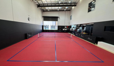 a picture of a red pickleball court