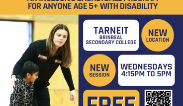 a woman dressed in black sports kit is helping a child