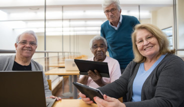 A group of seniors looking at tablets